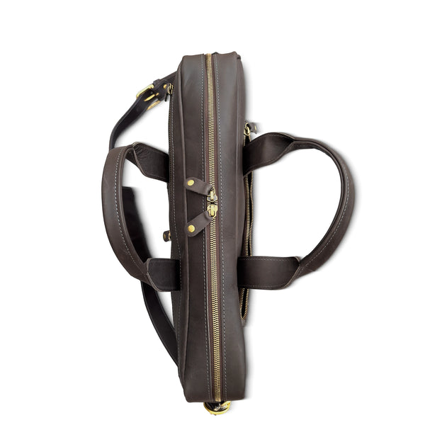 Brown leather bag with gold zipper on a white background