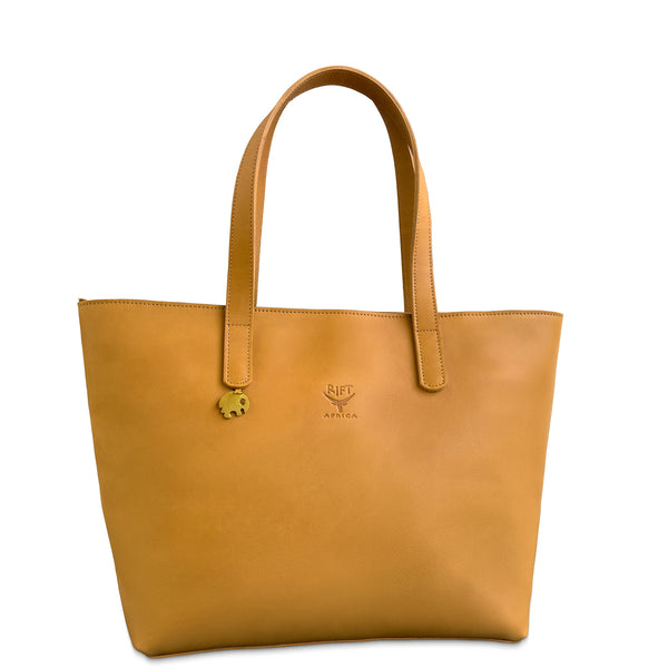 Brown leather tote bag with a visible brand logo on a white background
