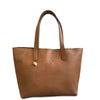 Brown leather tote bag with a visible brand logo on a white background