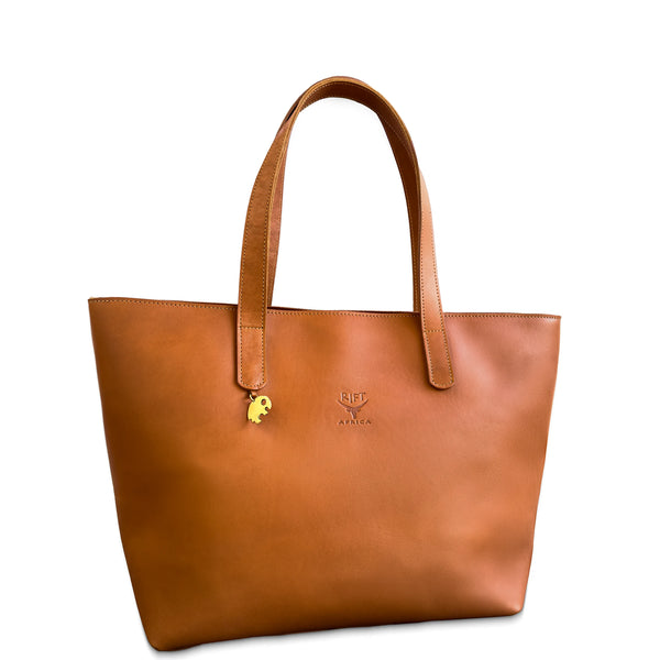 Brown leather tote bag with a visible brand logo on a white background