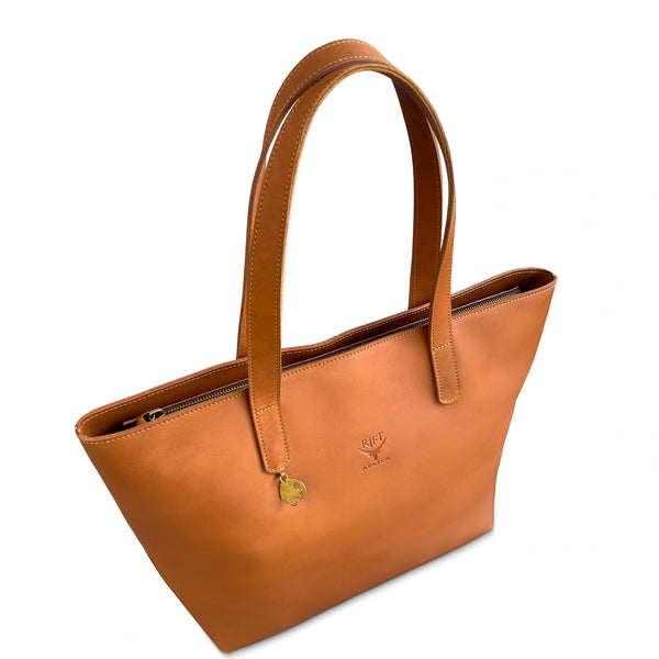 Brown leather tote bag with a visible brand logo on a white background