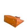 Brown leather bag with gold studs on a white background