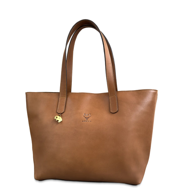 Brown leather tote bag with a visible brand logo on a white background
