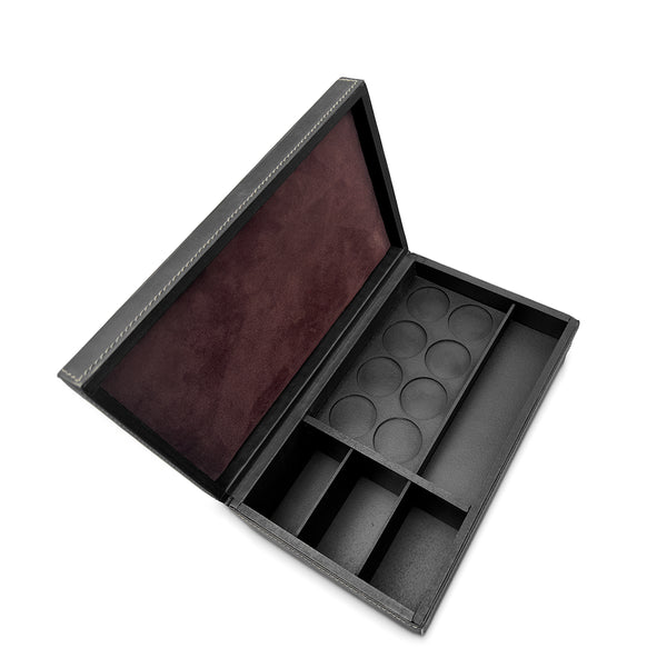 Black jewelry box with compartments on a white background