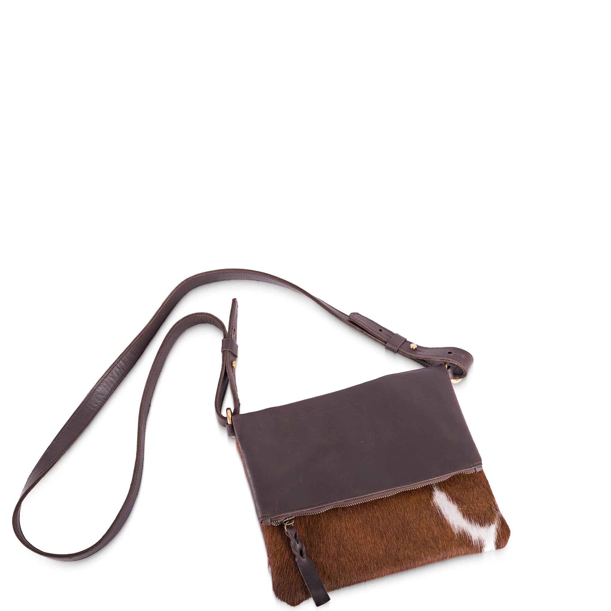 Brown leather crossbody bag with a contrasting fabric panel on a white background