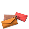 Three colorful leather envelopes (brown, orange, red) on a white background