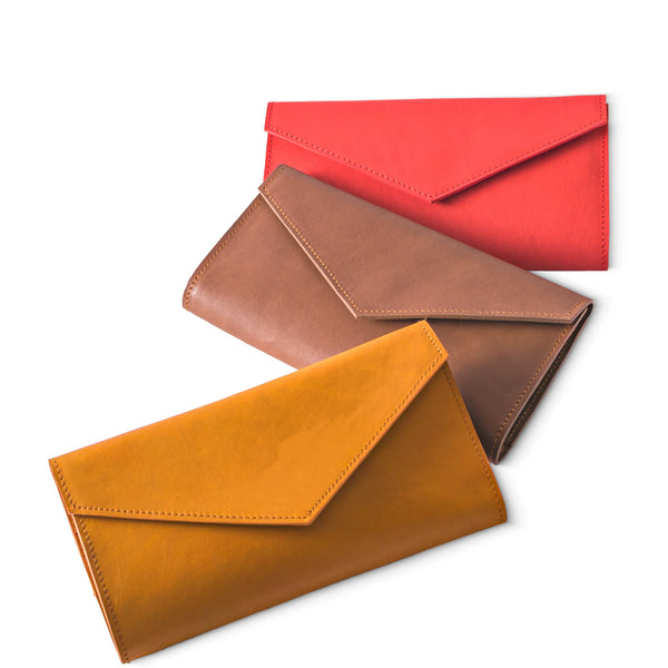 Three leather envelopes in red, brown, and orange on a white background