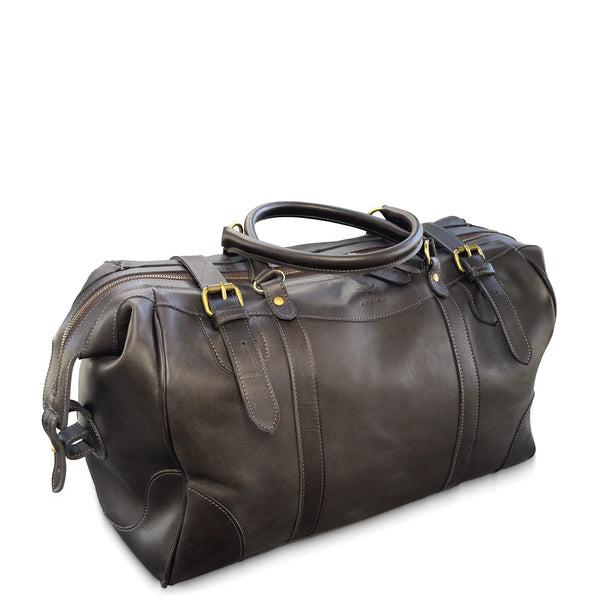 Brown leather duffel bag with gold buckles on a white background