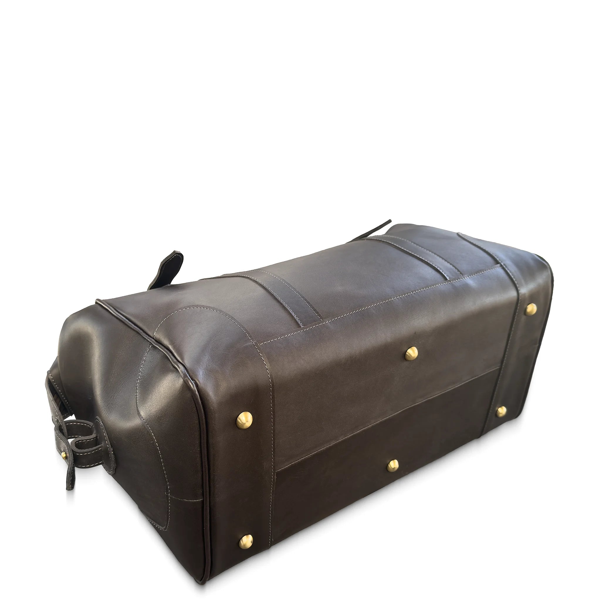 Brown leather duffel bag with gold studs on a white background