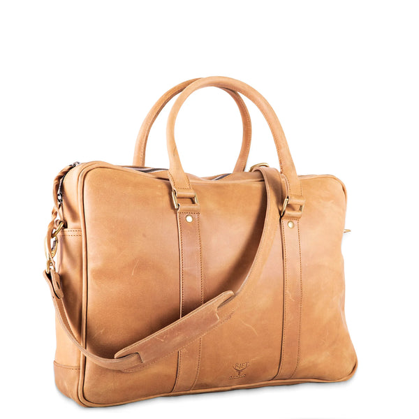 Brown leather bag with a shoulder strap on a white background