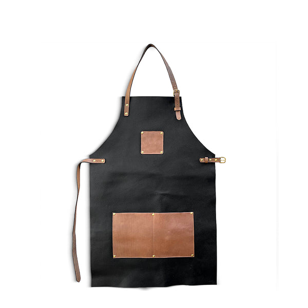 Black apron with brown leather patches on a white background
