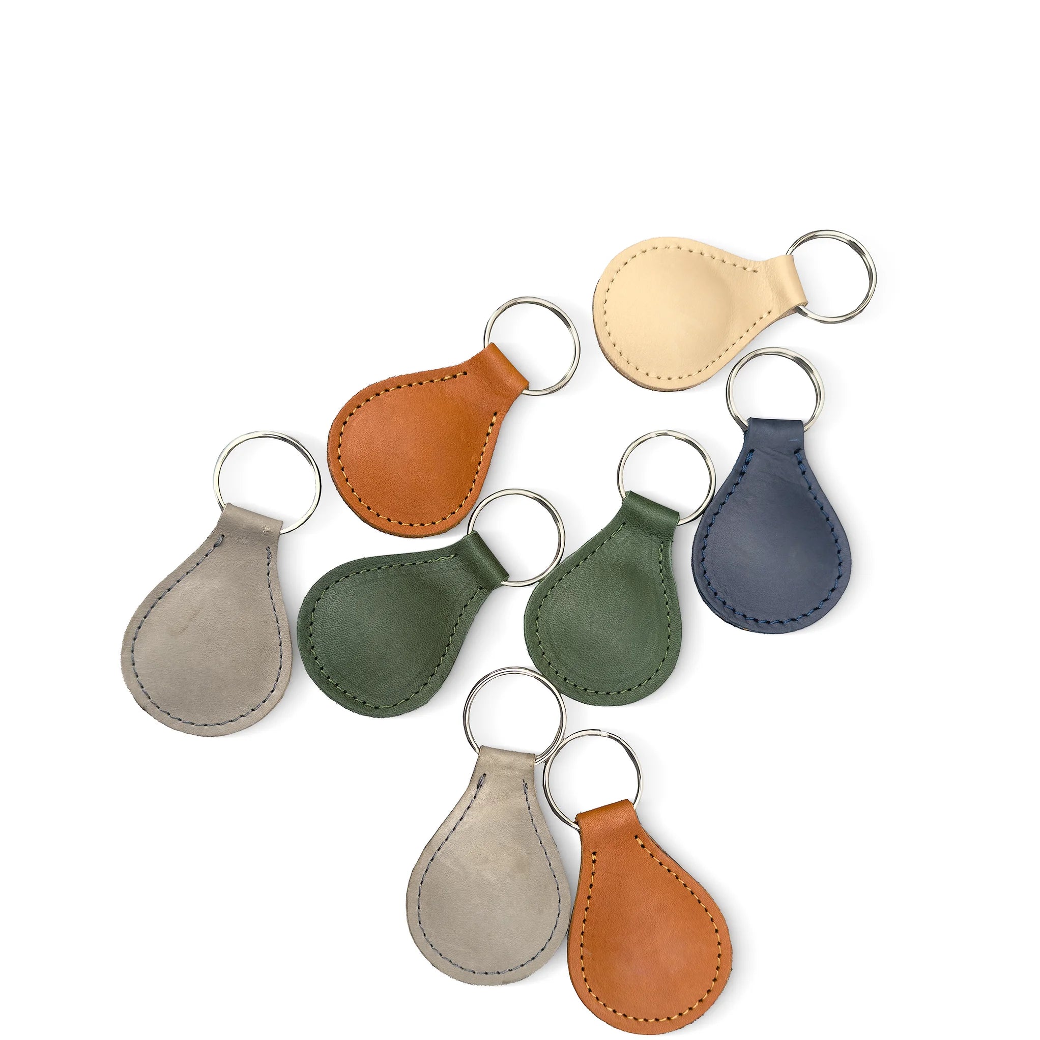 Set of leather keychains in various colors on a white background