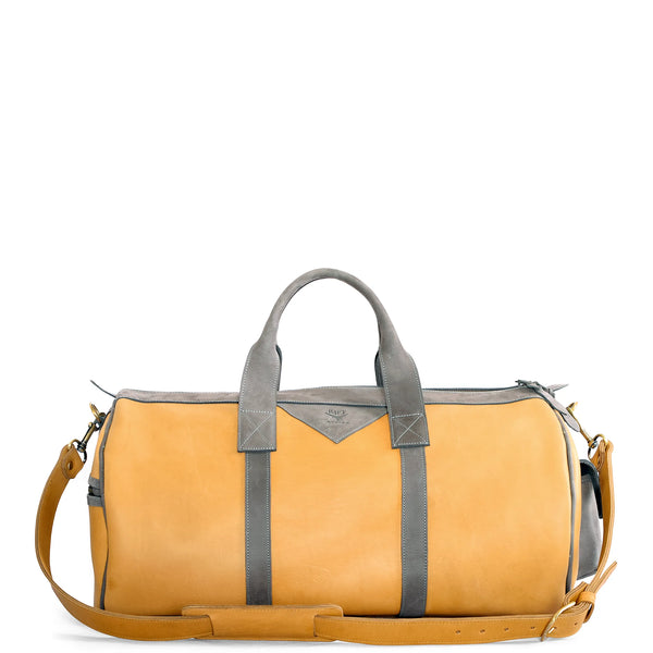 Yellow duffel bag with gray straps on a white background