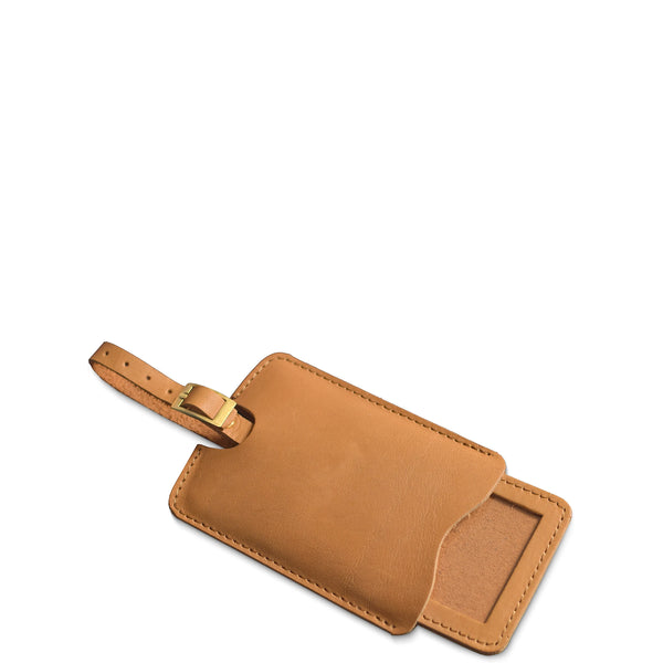 Brown leather luggage tag with gold accent on a white background