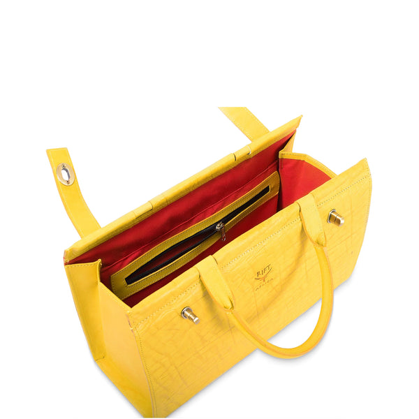 Yellow handbag with red interior on a white background