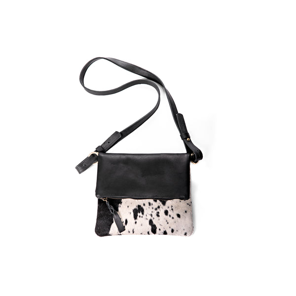 black  full-grain leather crossbody bag featuring front zipper pocket and adjustable shoulder strap