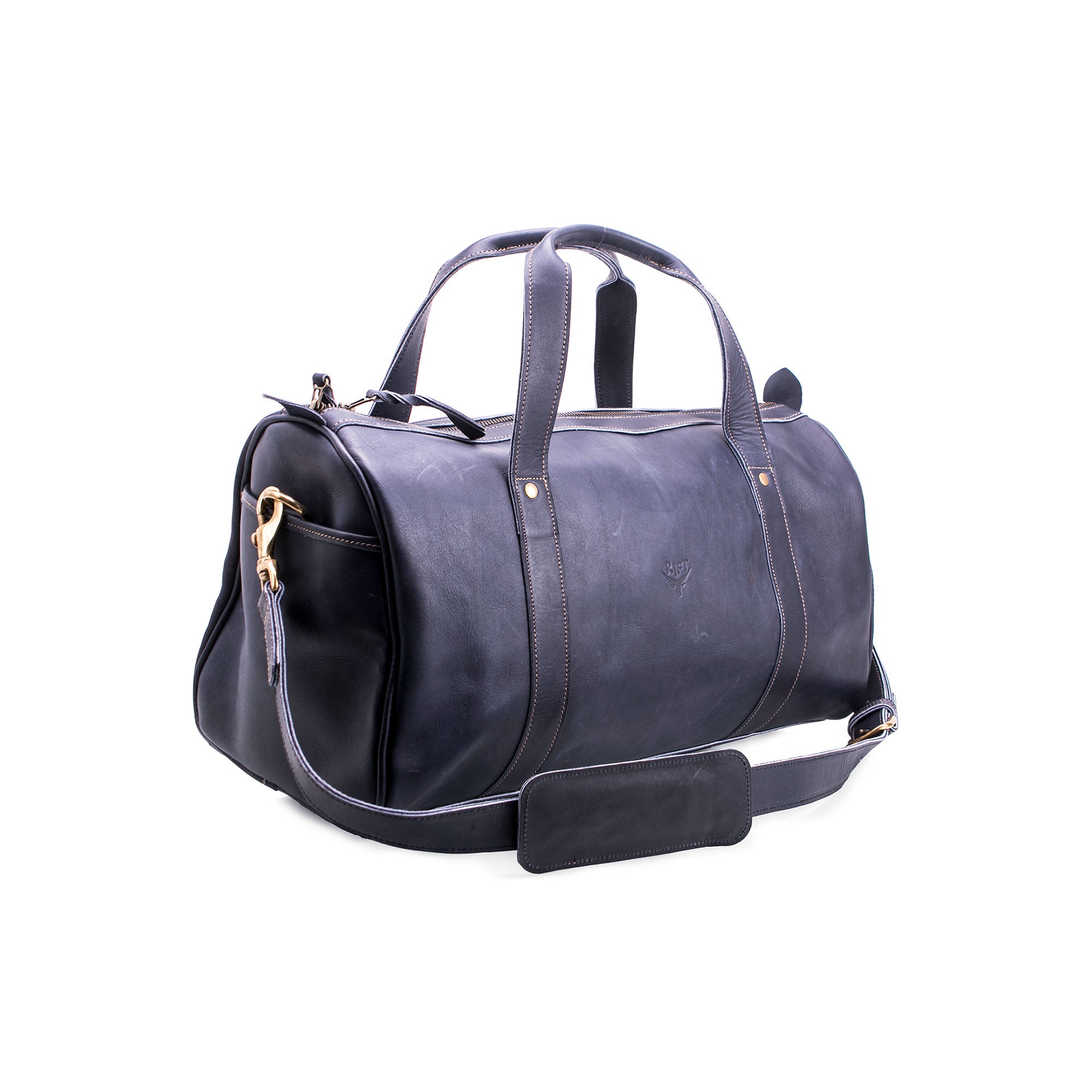 Black leather duffel bag with gold zipper pull on a white background