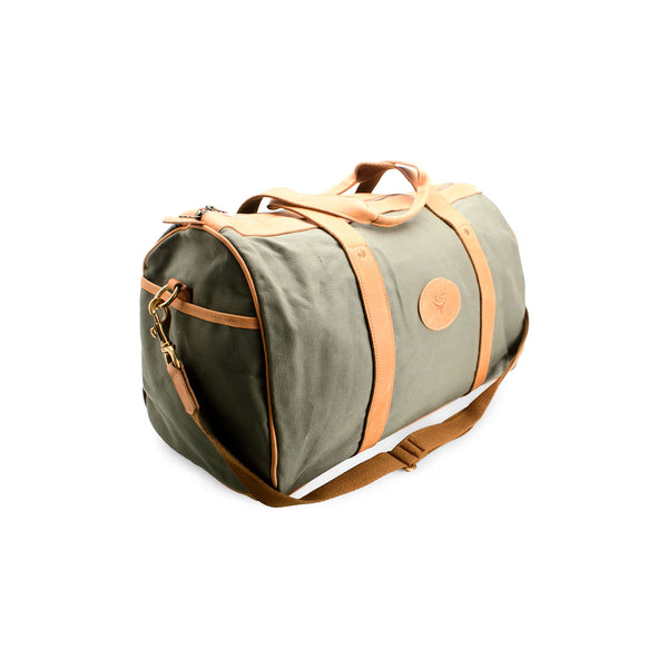 Green duffel bag with brown leather accents on a white background