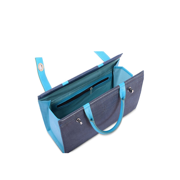 Blue and gray handbag with open front pocket on a white background