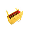 Yellow leather handbag with red interior on a white background