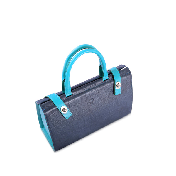 Blue leather handbag with turquoise handles on a white background
