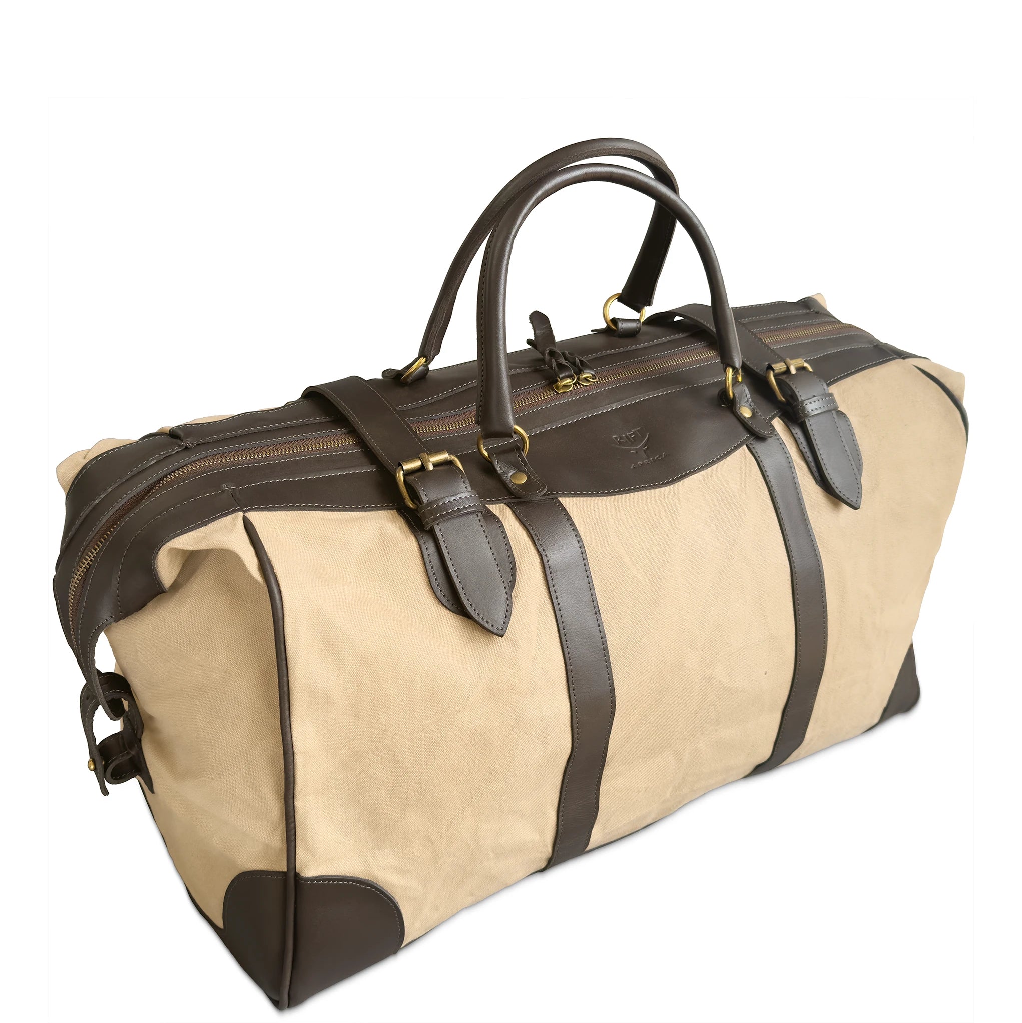 A canvas duffel bag with an beige body and dark brown leather handles,