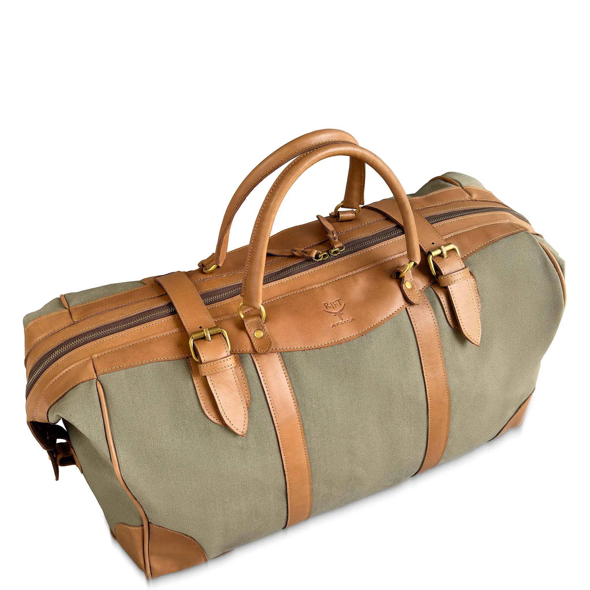 Green duffel bag with brown leather straps and handles on a white background