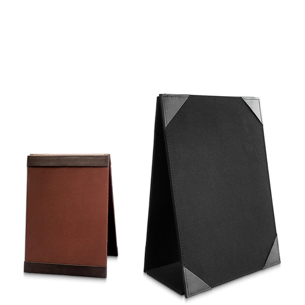 Two leather  menu stands, one black and one brown, on a white background