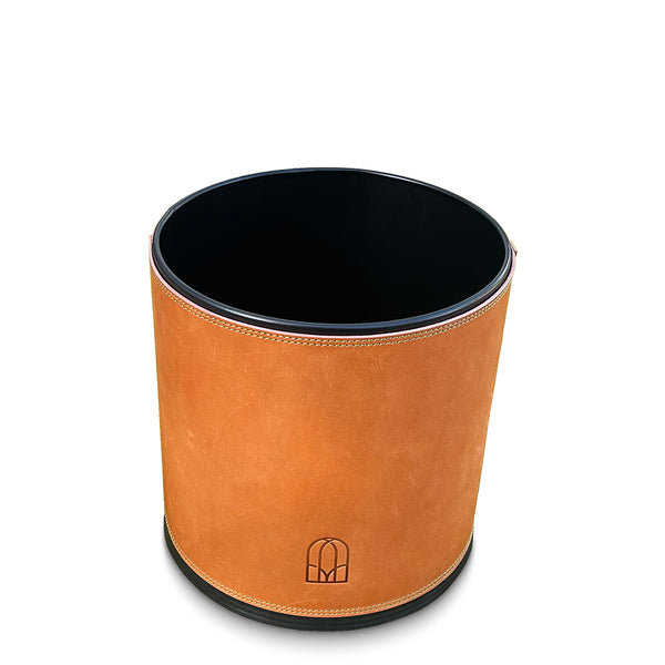 Round leather  waste paper bin with black interior on a white background