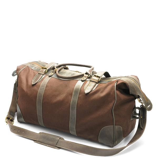 Brown duffel bag with gold accents on a white background
