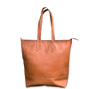 Brown leather tote bag with visible brand logo on a white background