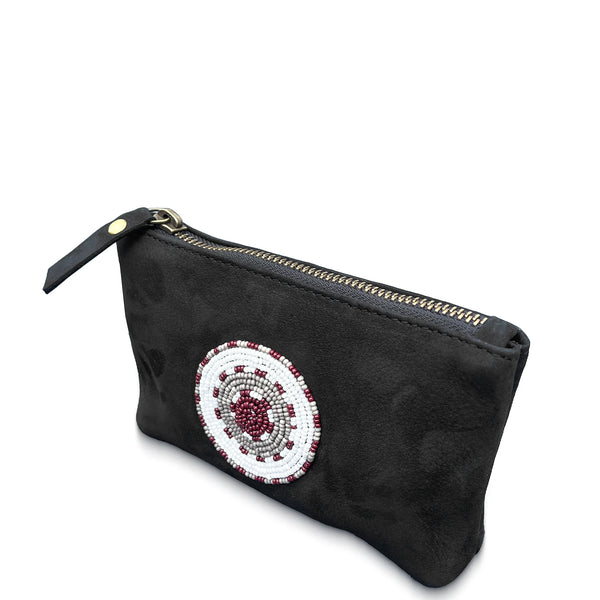 Black leather pouch with a beaded circular design on a white background