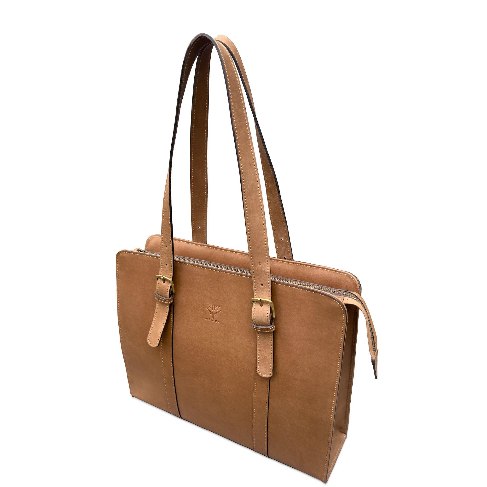 A mid brown leather briefcase with dual shoulder straps, gold-tone buckle details, and a zippered top closure, shown on a plain white background.