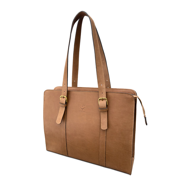 A mid brown leather briefcase with dual shoulder straps, gold-tone buckle details, and a zippered top closure, shown on a plain white background.