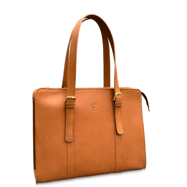 Brown leather briefcase with gold accents on a white background