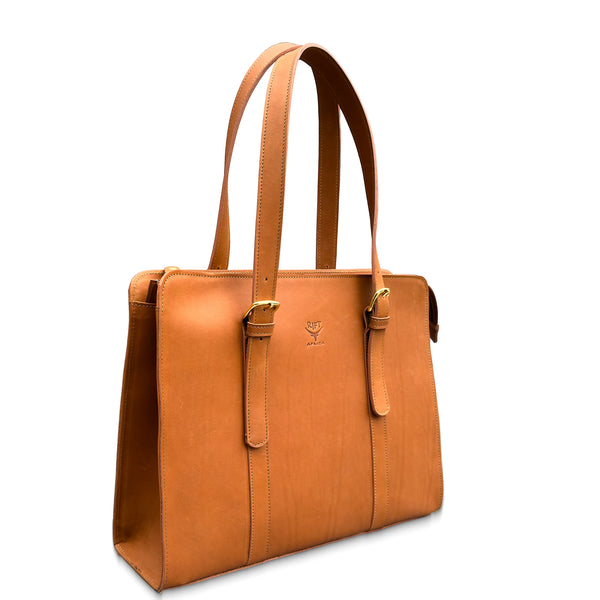Brown leather tote bag on a white background