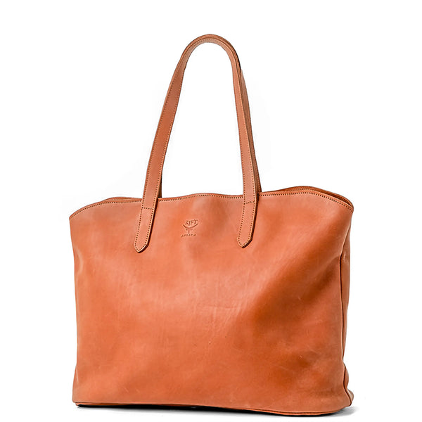 Brown leather tote bag on a white background