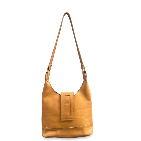 Brown leather handbag with a strap on a white background