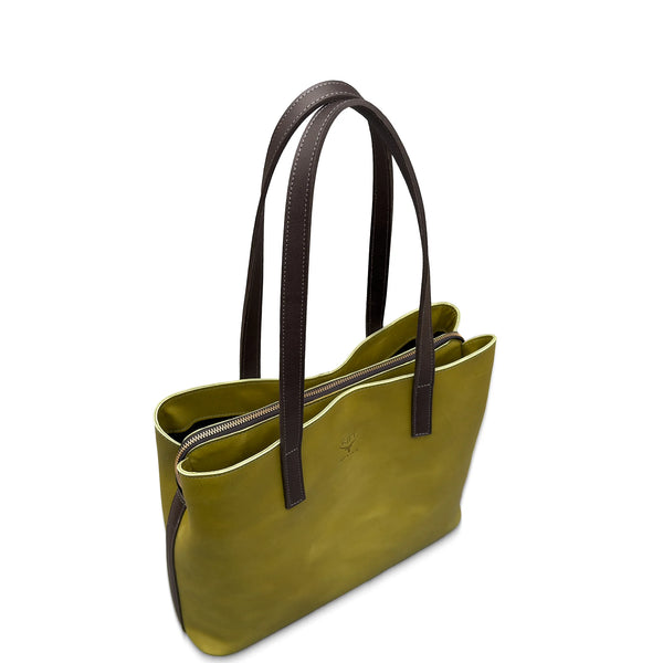 Green leather handbag with brown handles on a white background