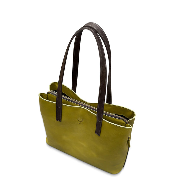Green leather handbag with brown handles on a white background