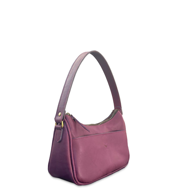Purple leather handbag on a white background