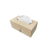 Beige tissue box with white tissues on a white background