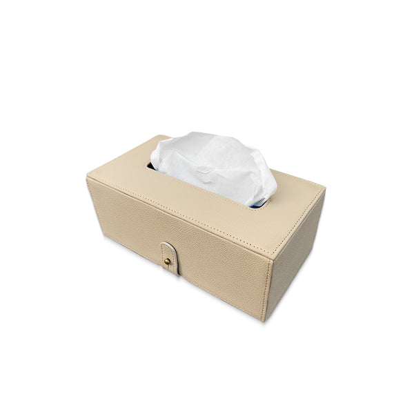Beige tissue box with white tissues on a white background