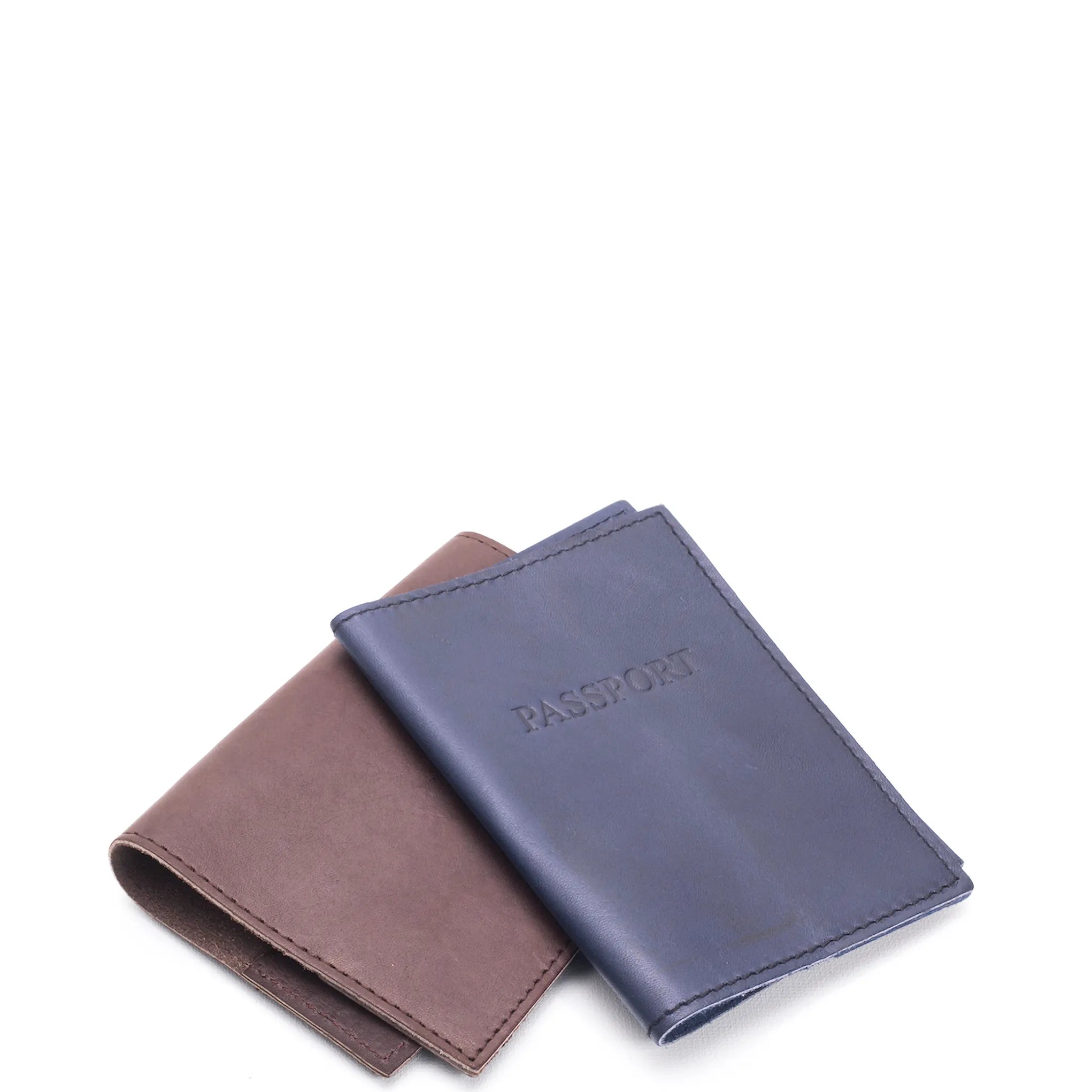 Two leather passport holders, one brown and one blue, on a white background.