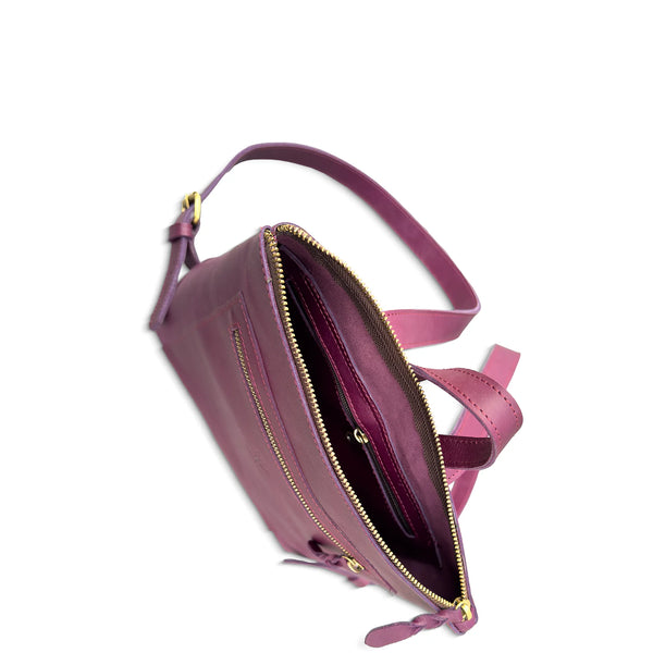 Purple handbag with gold zipper on a white background