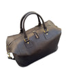 Brown leather duffel bag with gold hardware on a white background
