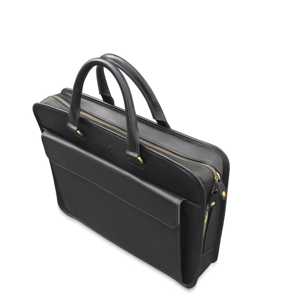 Black leather briefcase with gold zipper pulls on a white background
