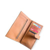 Open tan leather wallet with cards on a white background