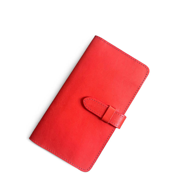 Red leather wallet with a strap on a white background