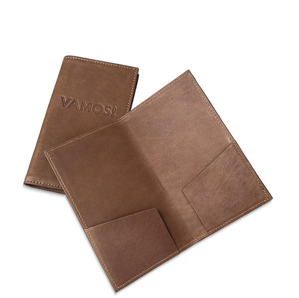 Brown leather bill presenter  with 'VAMOS!' embossed on a white background